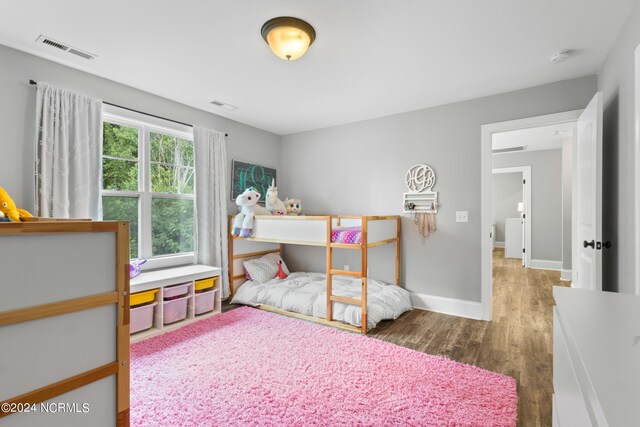 bedroom featuring dark hardwood / wood-style flooring