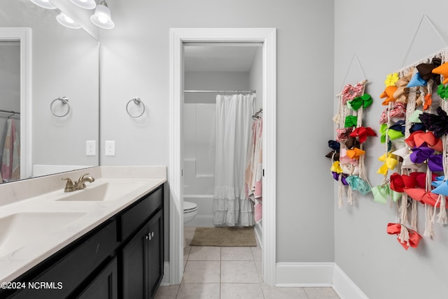 full bathroom with tile patterned flooring, shower / bath combination with curtain, toilet, and vanity