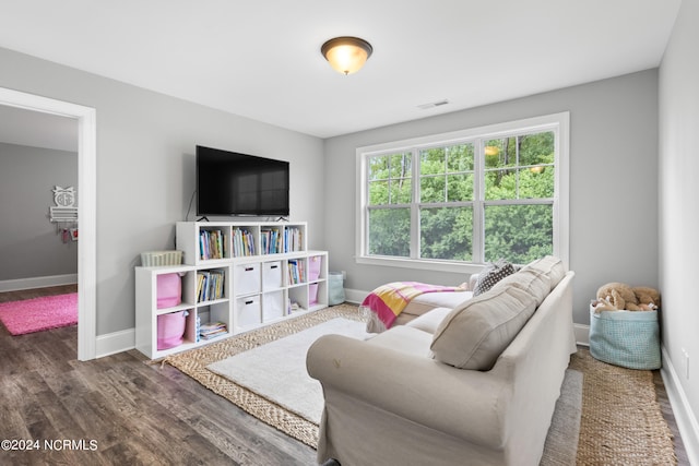 game room with dark wood-type flooring