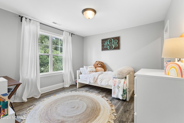 bedroom featuring dark wood-type flooring