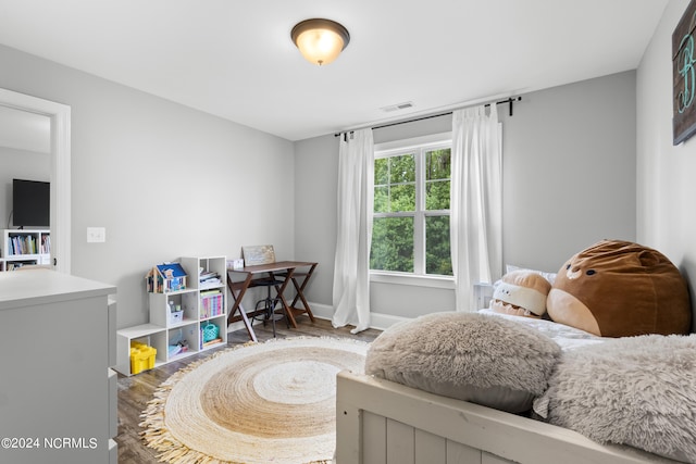 bedroom featuring wood-type flooring