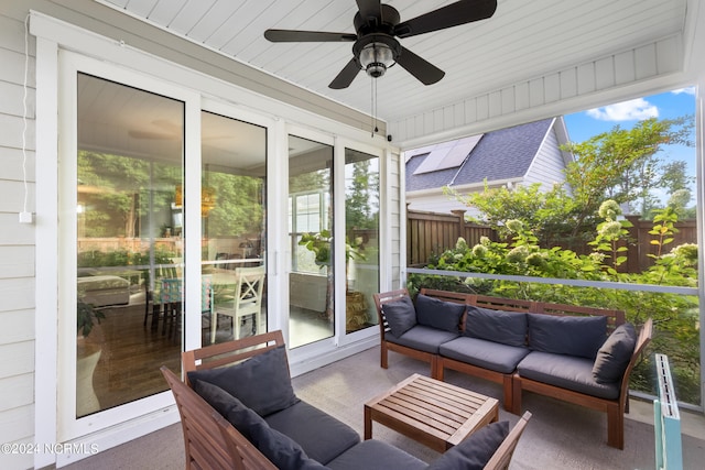 sunroom / solarium with plenty of natural light and ceiling fan