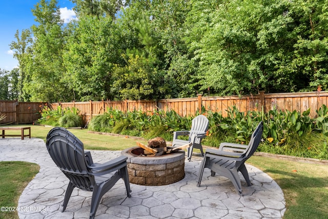 view of patio / terrace with a fire pit