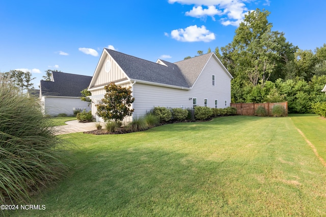 view of property exterior with a lawn