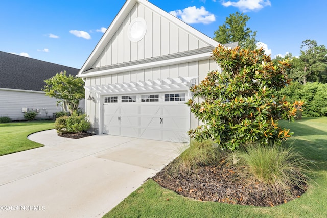 garage with a yard