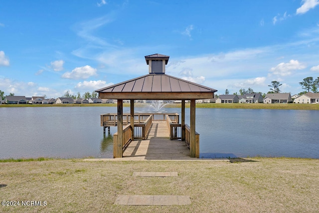 dock area featuring a gazebo and a water view