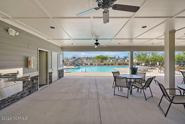 view of swimming pool with a patio area and exterior kitchen