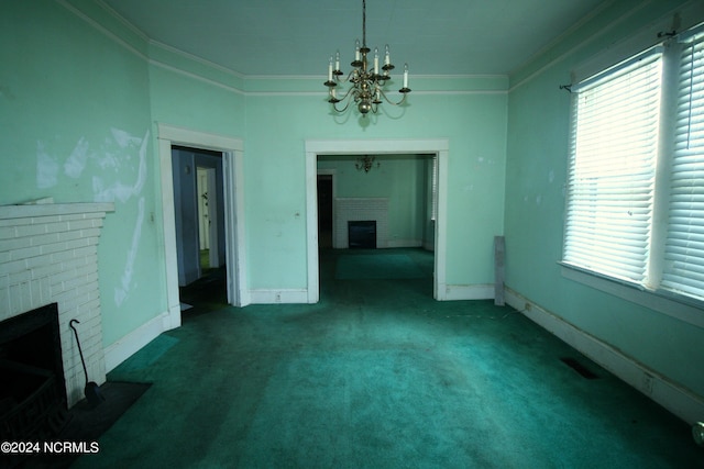 interior space with an inviting chandelier, a brick fireplace, carpet floors, and ornamental molding