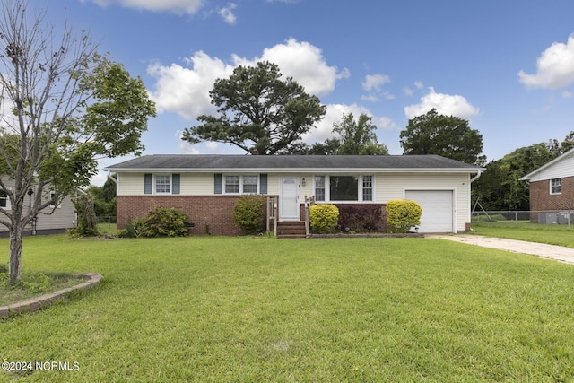 single story home with a garage and a front yard