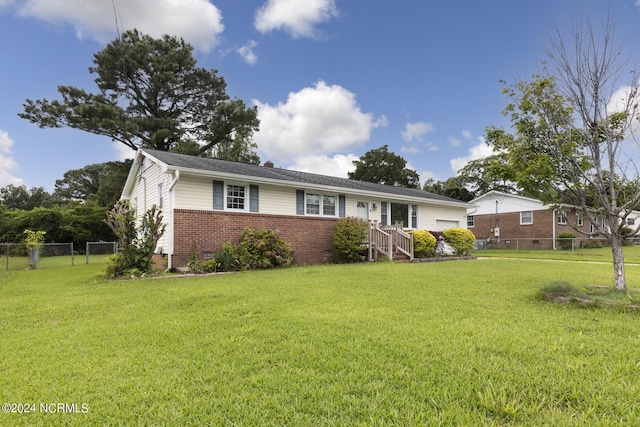 ranch-style home featuring a front lawn