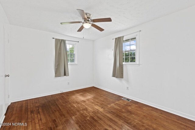 unfurnished room featuring hardwood / wood-style floors and ceiling fan