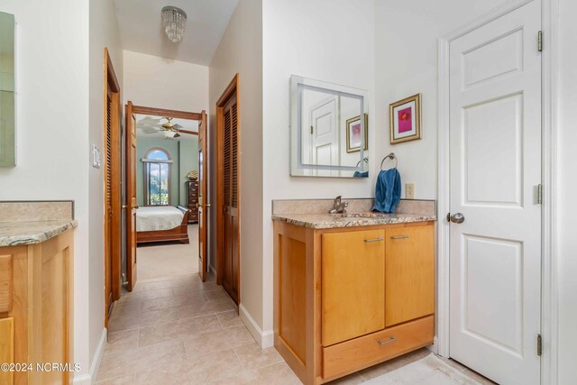 full bathroom with tile patterned floors, toilet, vanity, and combined bath / shower with glass door