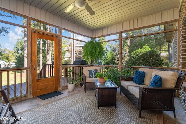 sunroom / solarium featuring an outdoor hangout area, ceiling fan, and plenty of natural light