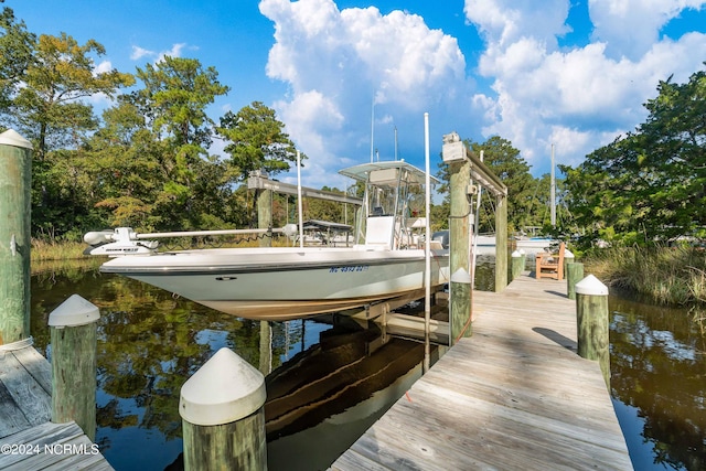 dock area featuring a water view and boat lift