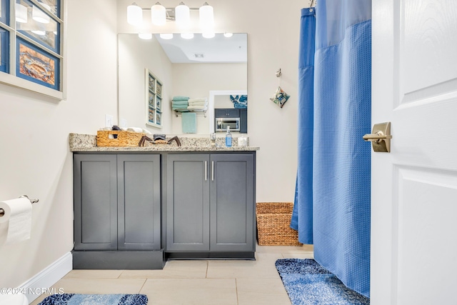 bathroom with vanity, a shower with curtain, and tile patterned flooring