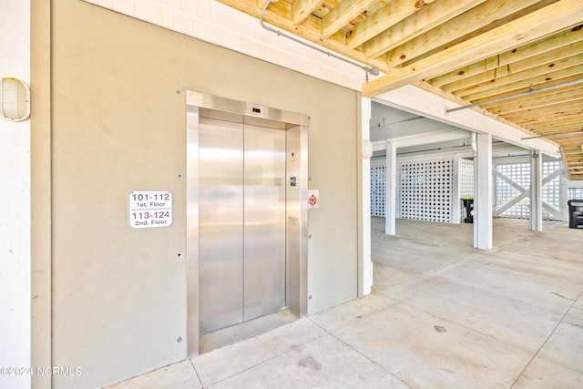 interior space featuring a patio area and elevator