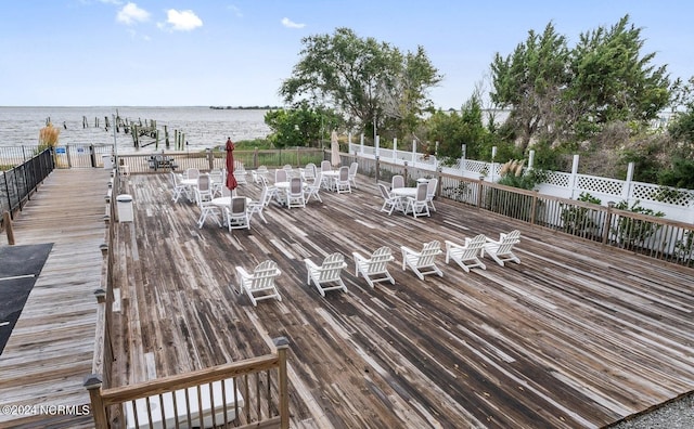 wooden deck featuring a water view