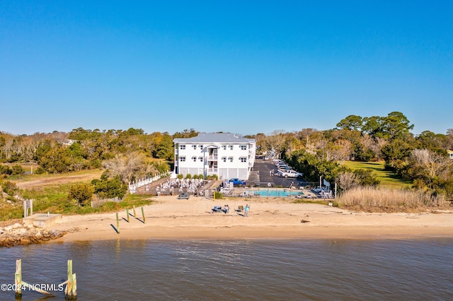 property view of water featuring a beach view