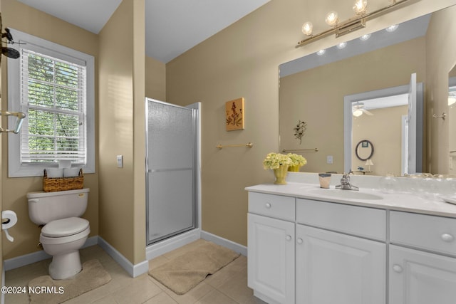 bathroom featuring tile patterned flooring, walk in shower, toilet, vanity, and ceiling fan