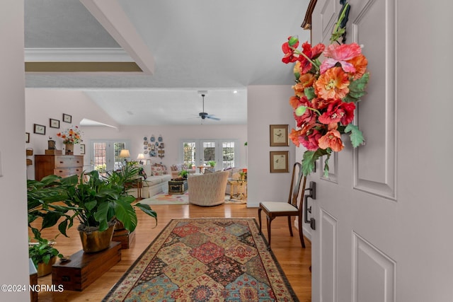 foyer with french doors, hardwood / wood-style floors, crown molding, and ceiling fan