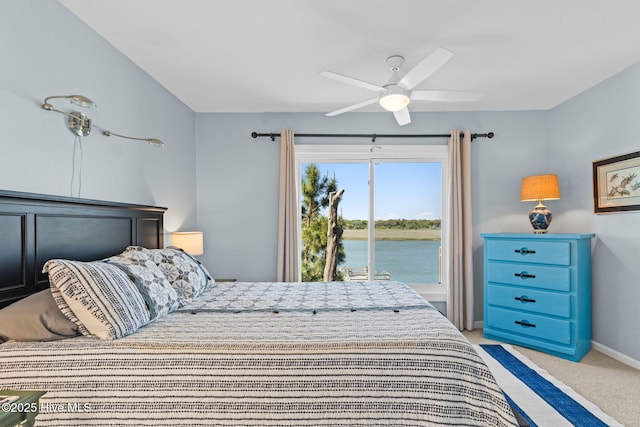 bedroom with a ceiling fan, baseboards, a water view, and light colored carpet