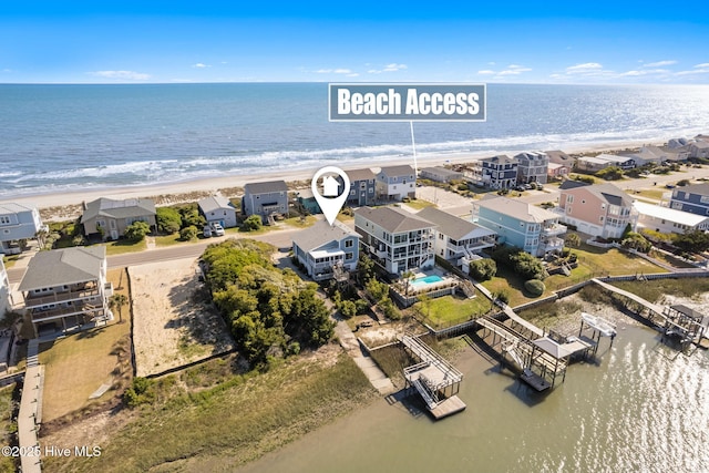bird's eye view with a view of the beach and a water view