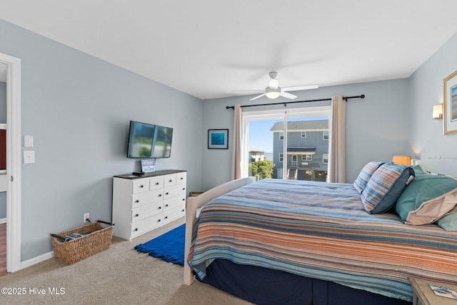 carpeted bedroom featuring baseboards and a ceiling fan