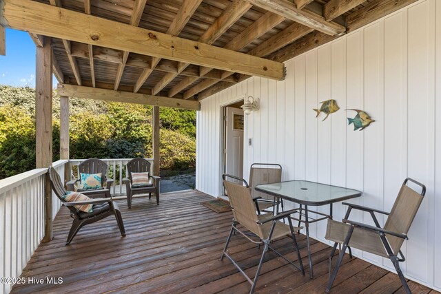 wooden deck with outdoor dining area