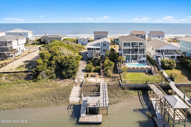 aerial view with a residential view and a water view