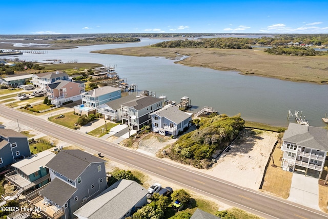 bird's eye view with a residential view and a water view