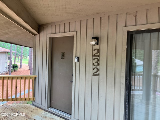 entrance to property featuring board and batten siding