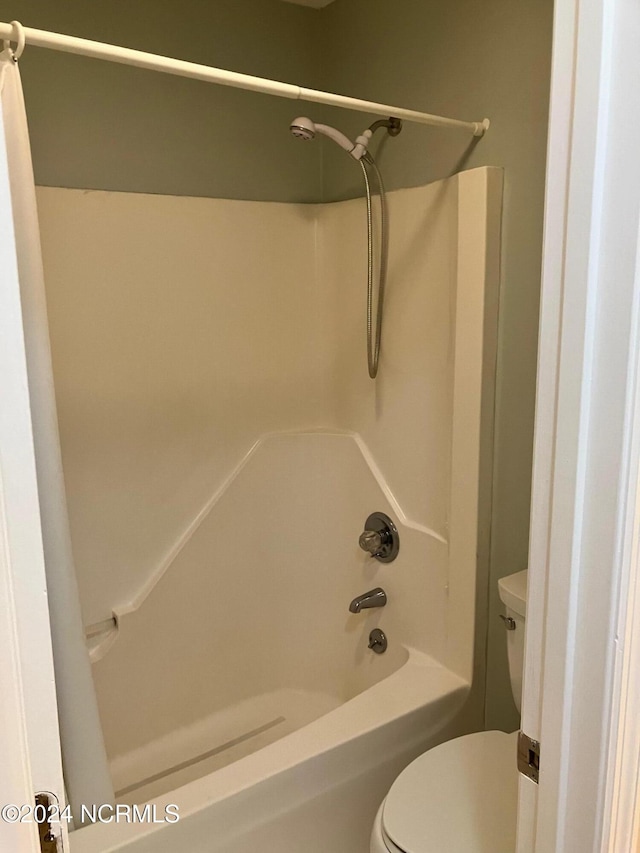 full bathroom with toilet and shower / washtub combination