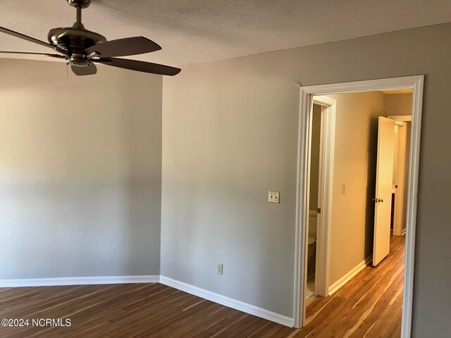 doorway with a textured ceiling, ceiling fan, a healthy amount of sunlight, and wood-type flooring