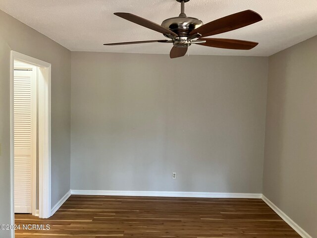 empty room featuring a textured ceiling, ceiling fan, and hardwood / wood-style floors