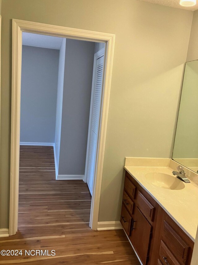 unfurnished room featuring a textured ceiling, ceiling fan, and wood-type flooring