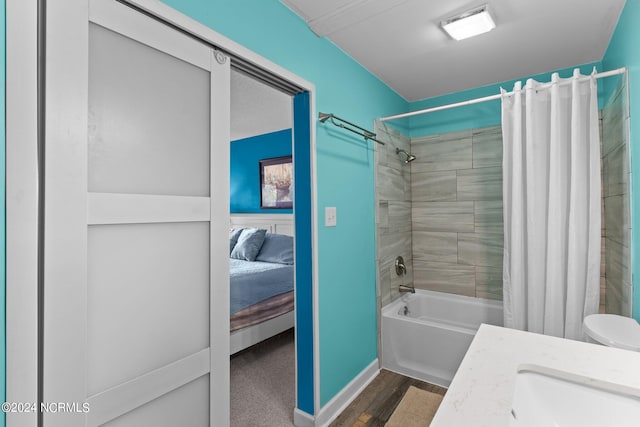 full bathroom featuring visible vents, shower / bathtub combination with curtain, vanity, ensuite bath, and wood finished floors