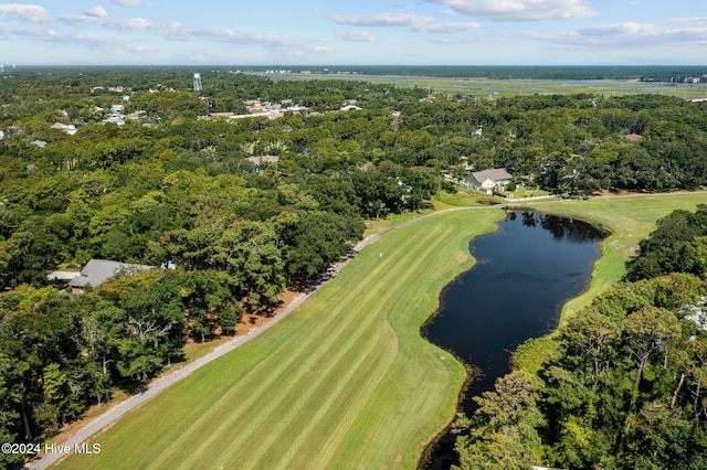 bird's eye view featuring view of golf course, a water view, and a wooded view