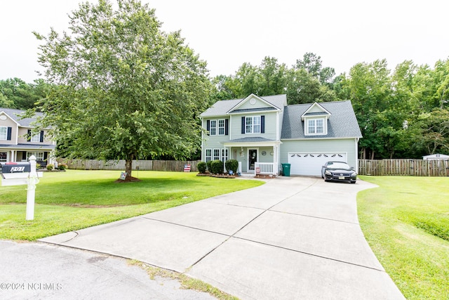 view of front of property featuring a garage and a front lawn