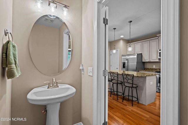 bathroom with wood finished floors