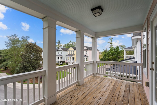 wooden deck featuring a residential view