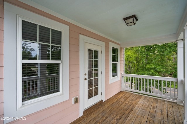 wooden deck featuring covered porch