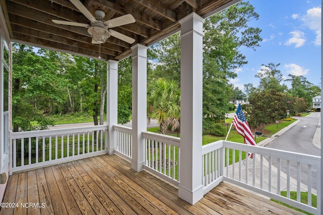 deck featuring covered porch and ceiling fan