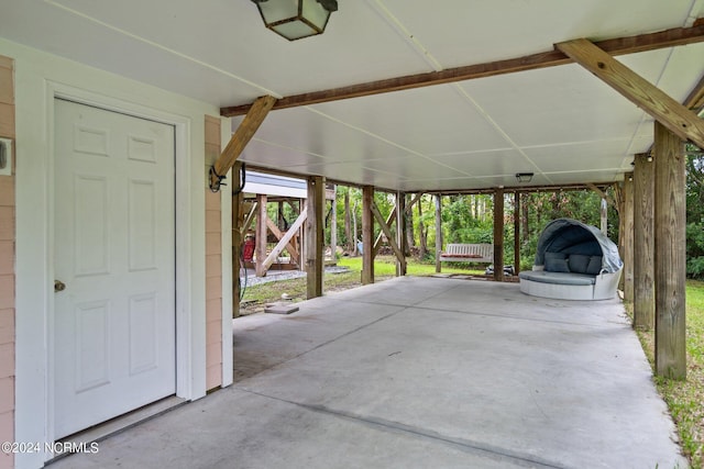 view of patio / terrace with a carport