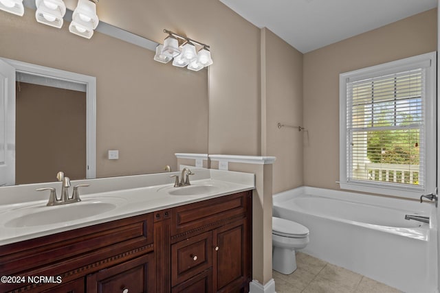 full bath featuring a sink, a garden tub, tile patterned floors, and toilet