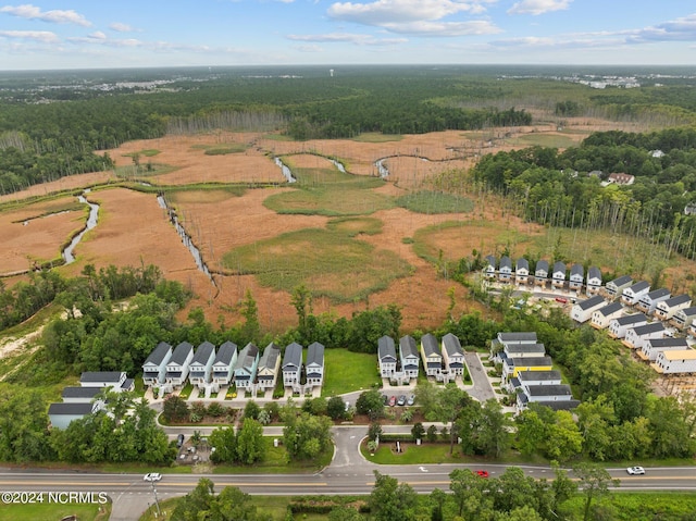 aerial view featuring a residential view and a forest view