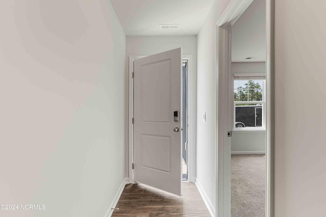 corridor featuring dark hardwood / wood-style floors