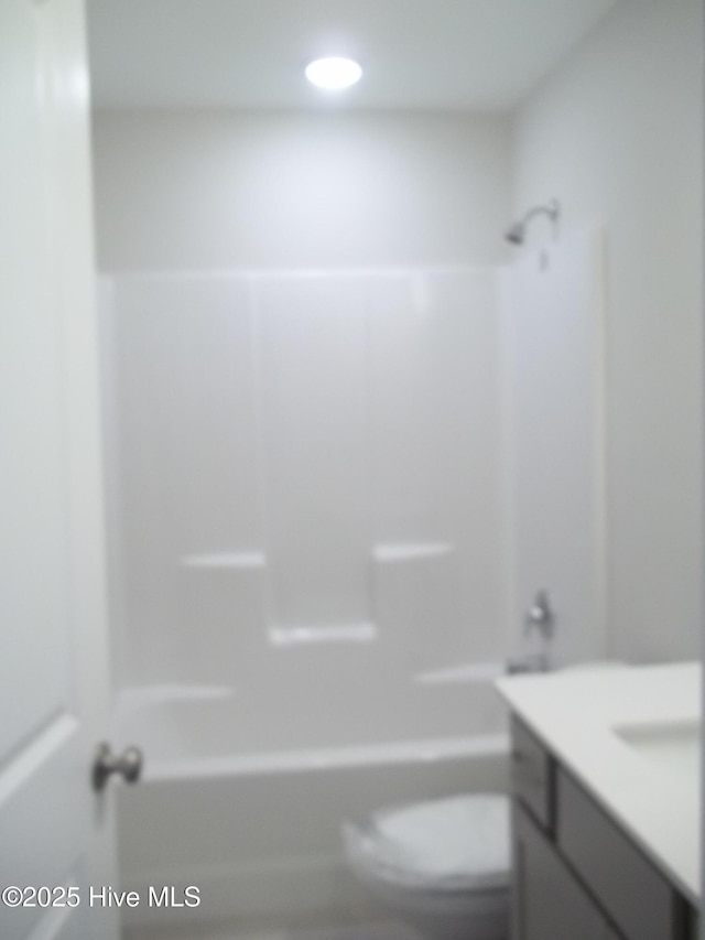 full bathroom featuring vanity, toilet, recessed lighting, and shower / bathtub combination