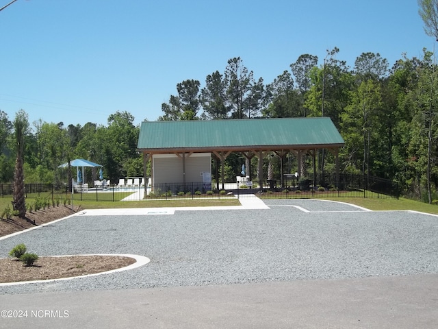 view of property's community with fence