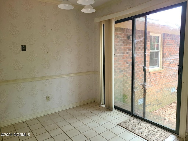 entryway featuring light tile patterned flooring, visible vents, baseboards, and wallpapered walls