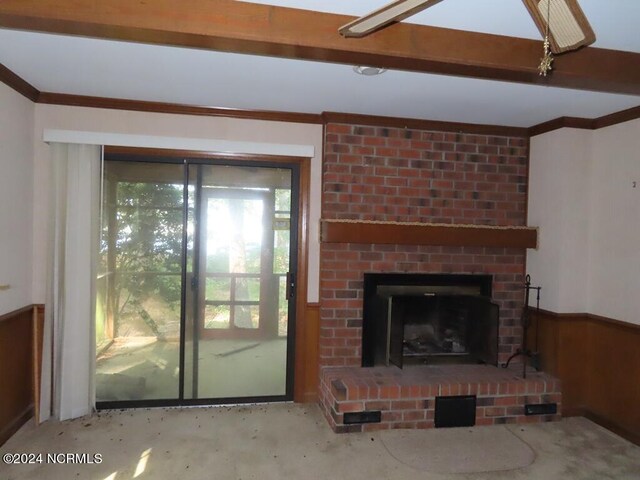 103 Creekview Ln, Washington, NC 27889 - unfurnished living room featuring wainscoting, a fireplace, and wooden walls